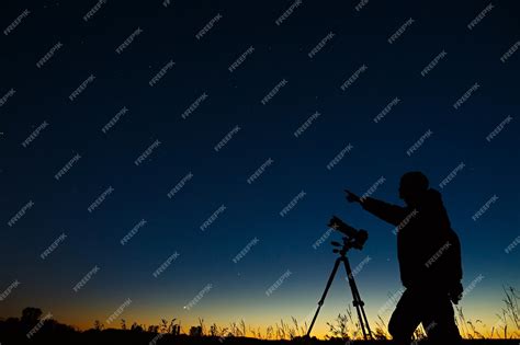 Premium Photo | The astronomer photographs the night starry sky on a ...