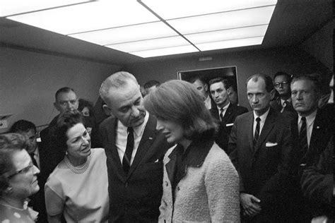 Lyndon B. Johnson and Jackie Kennedy on the Air Force One just minutes after the assassination ...