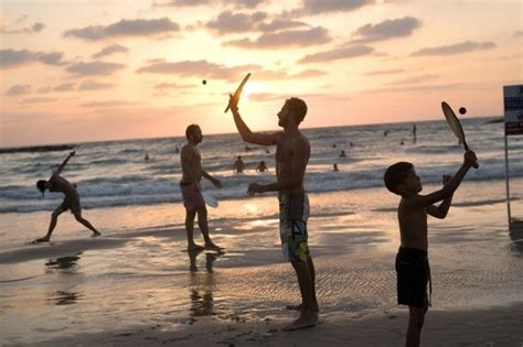 Israel beaches alive with sound of 'national sport' matkot | Beach, Tel aviv beach, Matkot