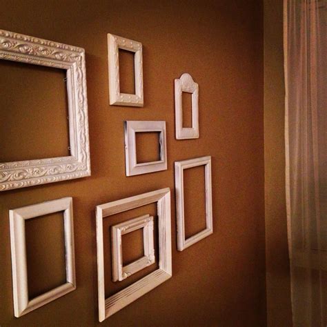 White frame collage on painted wall | Stairway decorating, Frame ...