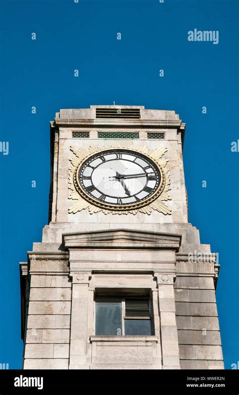 Clock face on the Cocker Clock Tower set against a deep blue sky in ...