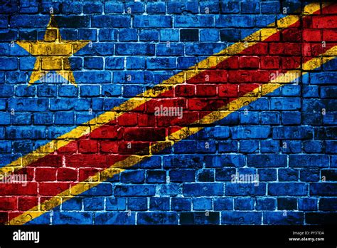 National flag of Democratic Republic of Congo on a brick background ...