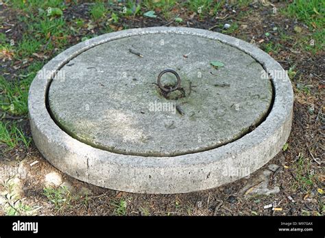 Concrete lid at septic tank reservoir Stock Photo - Alamy