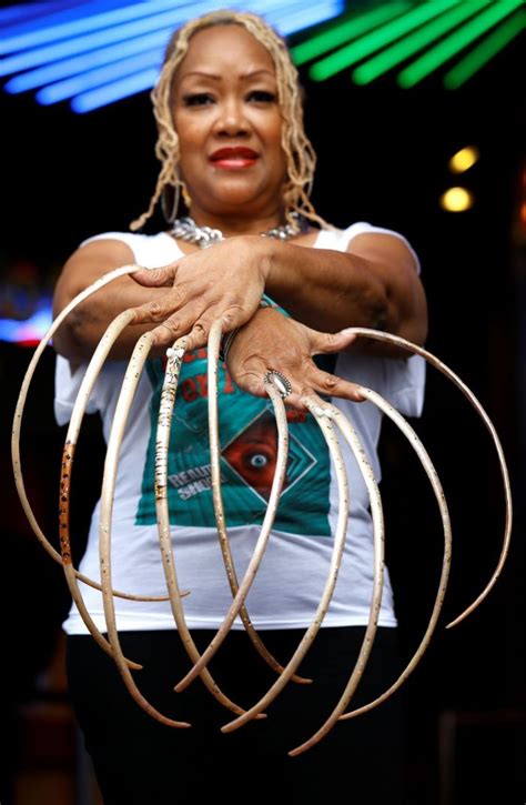 Ayanna Williams broke the world record for having the longest fingernails. Williams has been ...