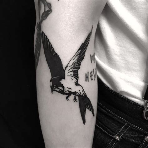 Swallow tattoo on the forearm done at BK Ink Studio - Tattoogrid.net