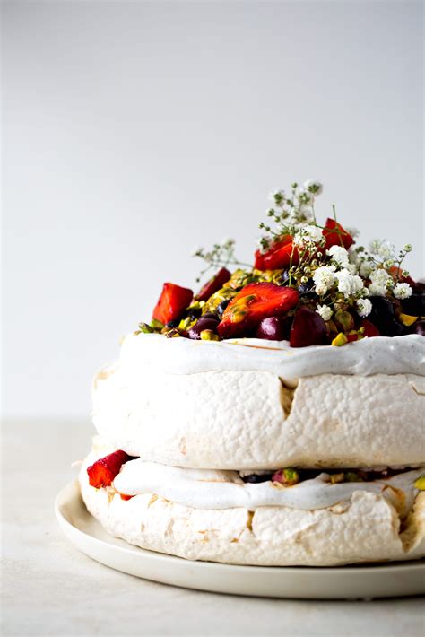 Vegan Pavlova with Saffron Berries Passionfruit + Pistachios | The Floured Kitchen