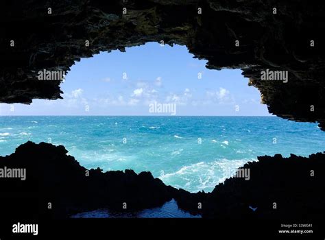 The view of the ocean seen from inside a cave Stock Photo - Alamy