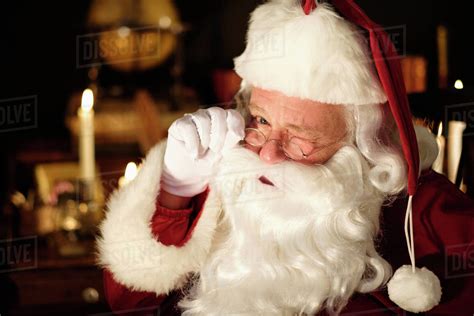 Portrait of Santa Claus winking - Stock Photo - Dissolve