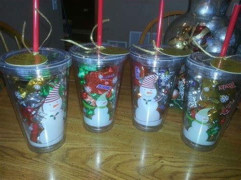 four plastic cups with christmas decorations on them