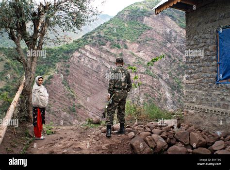 Border security force soldier with woman of Urusa ; Uri ; Jammu and Kashmir ; India NO MR 7 ...