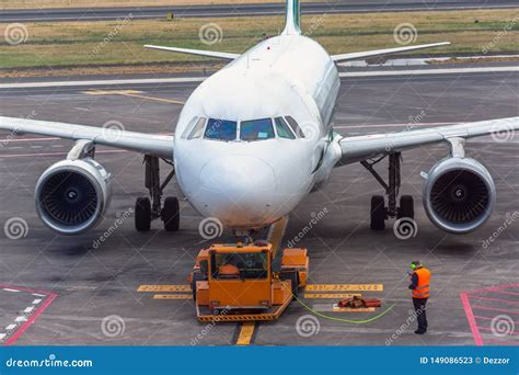 Tug Pushback Tractor In The Airport. Editorial Image | CartoonDealer ...