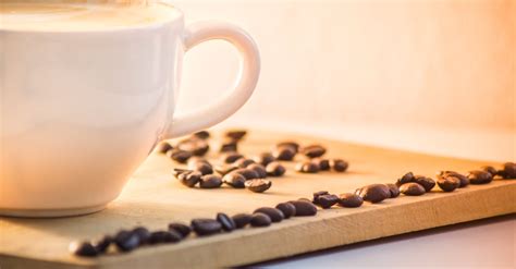 White Ceramic Coffee Mug With Cream Beside Black Coffee Beans · Free ...