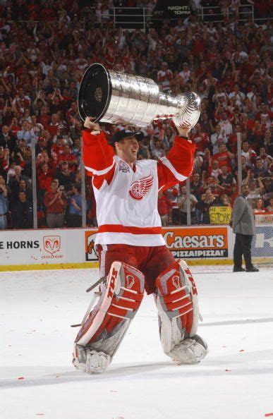 Dominik Hasek hoisting Lords Stanley Cup for the first time in 2002 ...