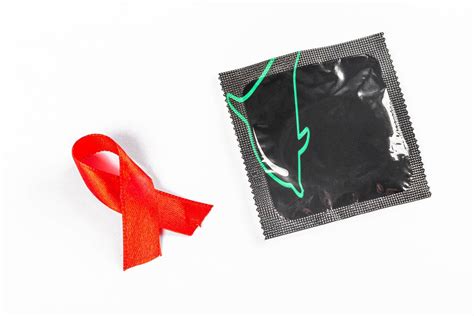 Fight against sexually transmitted diseases. Aids awareness sign red ribbon. World Aids Day ...