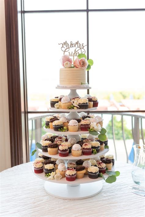 Jess and Adam's springtime ceremony on the patio by the palm trees and pool at the Ocean Club in ...