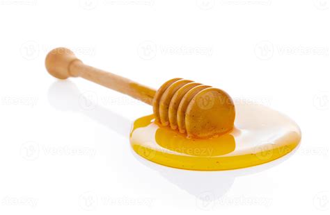 Wooden honey dipper with honey 4287695 Stock Photo at Vecteezy