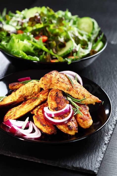 Marinated chicken breast stripes with salad | Stock image | Colourbox