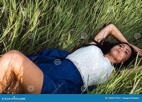 Beautiful Girl Lying Down At Grass Royalty-Free Stock Image | CartoonDealer.com #138472744