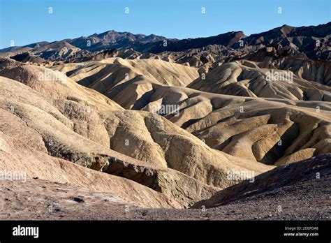 View from Zabriskie Point, a badlands landscape created by erosion, at Death Valley, California ...