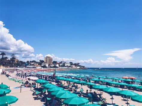 The Santa Marinella beach is filled with colorful umbrellas available ...