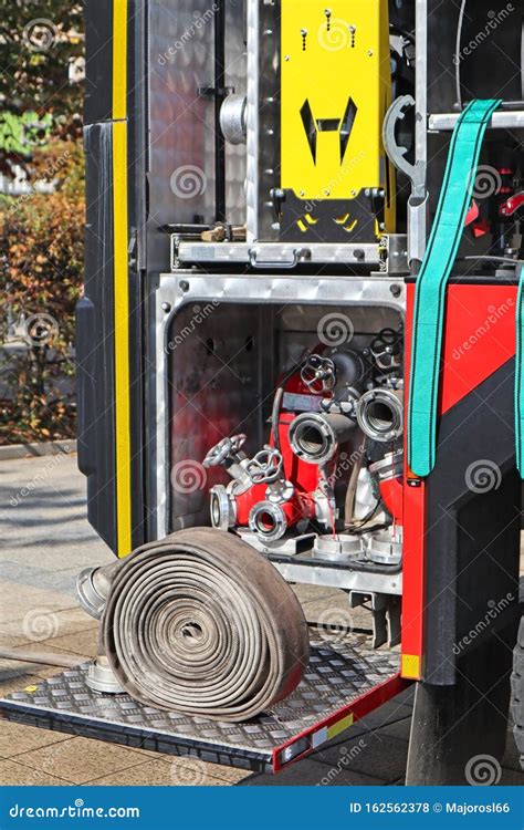 Part of the Fire Truck with Hose Stock Photo - Image of water, spraying: 162562378