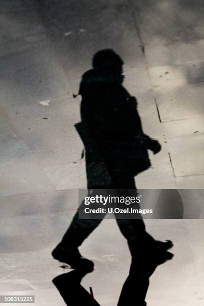 60 Puddle Pavement Silhouette Stock Photos, High-Res Pictures, and ...