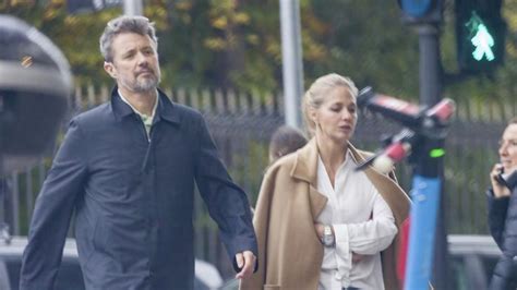 a man and woman walking down the street