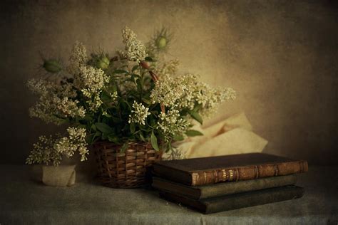 Still Life With Old Books And White Flowers In The Basket Photograph by Jaroslaw Blaminsky