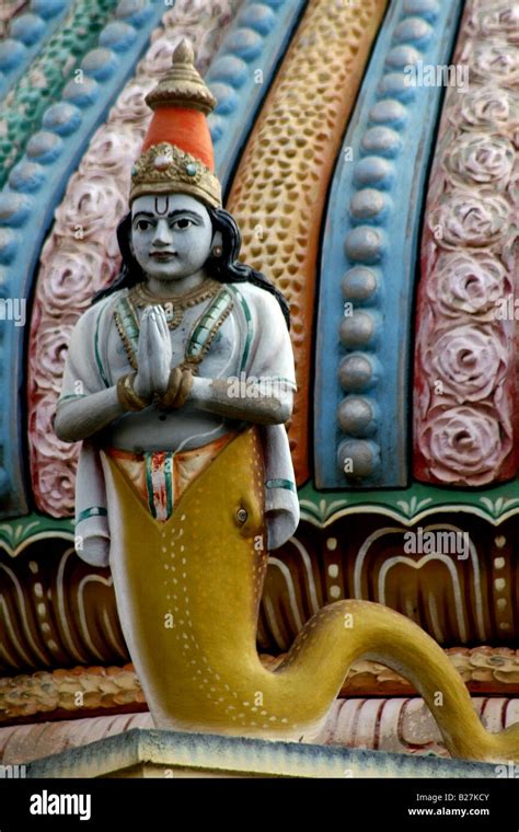 Statue on a Hindu temple roof tower of Matsya avatar or fish ...