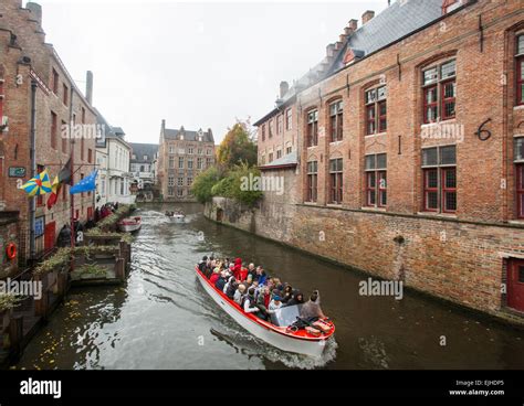 Canal boat tour in Bruges, Belgium Stock Photo - Alamy