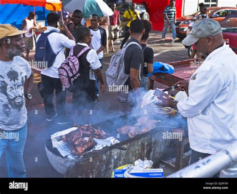 dh St George GRENADA CARIBBEAN Food Street market barbecue stall man ...