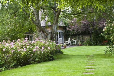 Images: cottage garden patio | Summer cottage garden with a small patio — Stock Photo © Yolfran ...