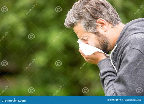 Man with allergy sneezing stock image. Image of illness - 89478449