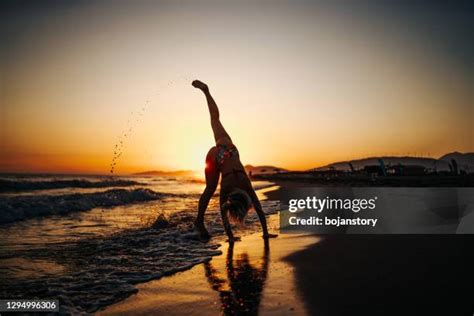 Woman Cartwheels Silhouette Photos and Premium High Res Pictures ...