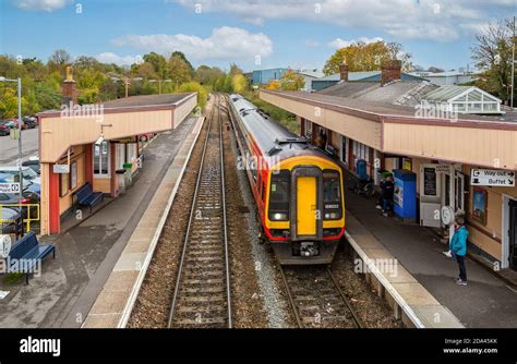 Diesel electric commuter train pulling into Warminster Railway Station ...