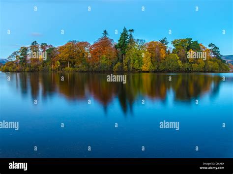 An view of one of the islands in Derwentwater , Keswick. it shows trees in their autumn foliage ...