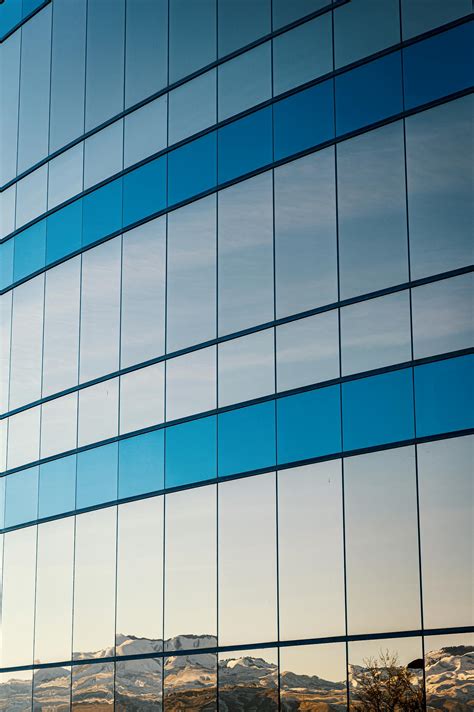 Blue and White Glass Walled Building · Free Stock Photo
