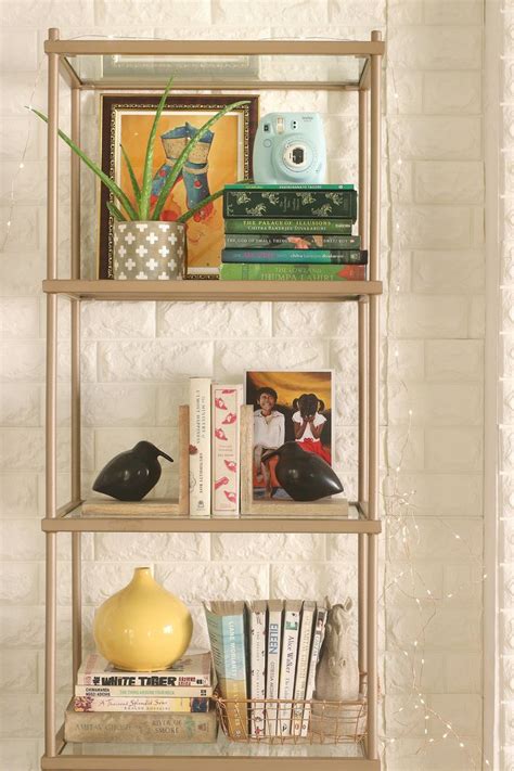 Gold bookcase styling | Bookcase styling, Bookcase, Decor