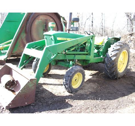 JOHN DEERE 2010 TRACTOR WITH FRONT END LOADER BUCKET