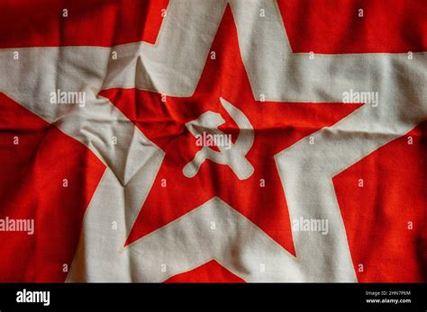 Old red communist flag with hammer and sickle Stock Photo - Alamy