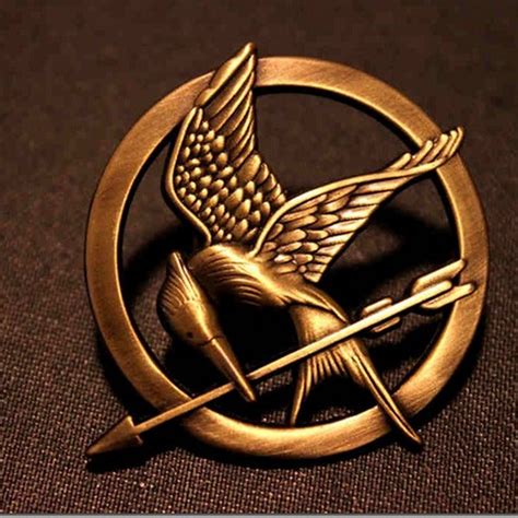 Hunger Games Mockingjay Pin Giveaway - Laces and Tiaras