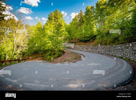 bend in the mountain road Stock Photo - Alamy