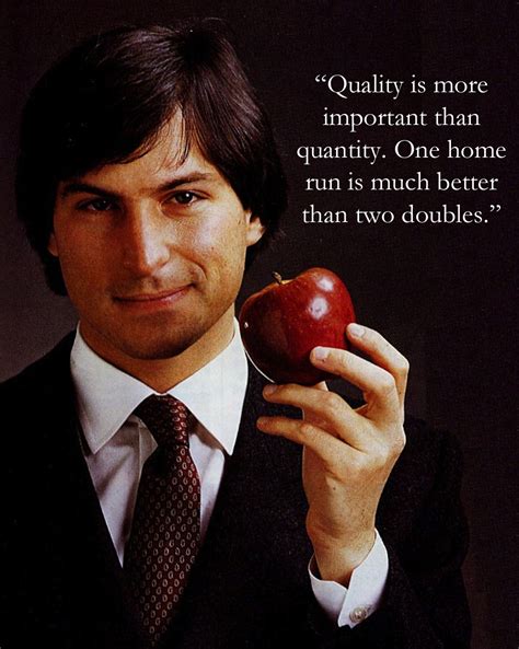 a man holding an apple in his right hand and wearing a suit on the other