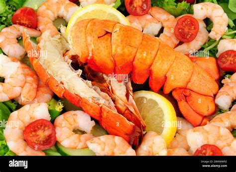 Cooked lobster tails with a fresh salad background Stock Photo - Alamy