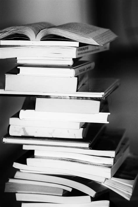 Download Greyscale Photo Of A Pile Of Books Wallpaper | Wallpapers.com