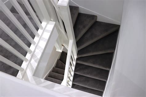 An impressive painted double winder staircase complete with gallery landing, simple in design ...