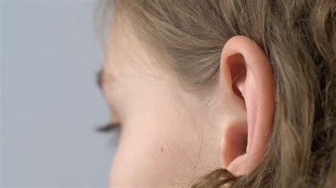 Close-up View Of Young Girl's Ear: Exploring Stock Footage SBV-338430742 - Storyblocks