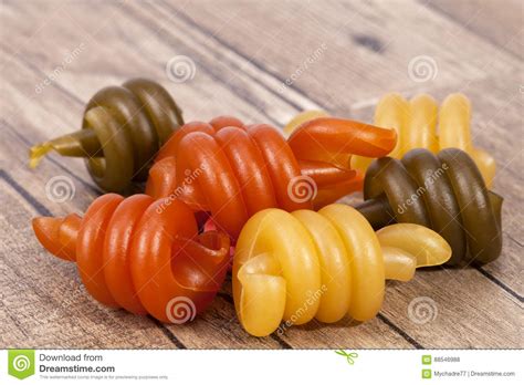 Spiral Pasta Trottole Tricolore on Wooden Plank Stock Photo - Image of ingredient, objects: 88546988