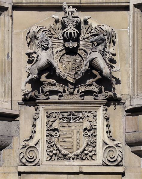 Royal coat of arms (Hanoverian period), and the arms of the college, above the Old Gatehouse at ...