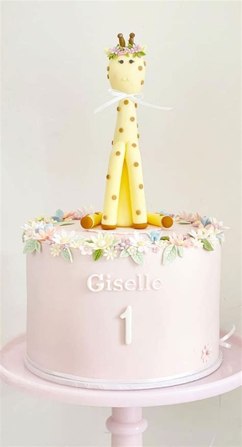 40 Cute First Birthday Cakes in 2022 : Blush Pink Cake Topped with Giraffe